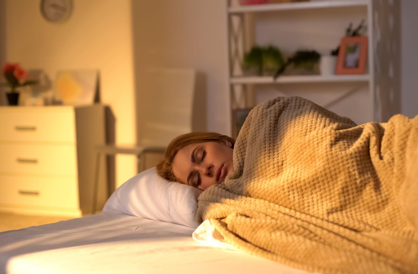 A person is sleeping on the bed.